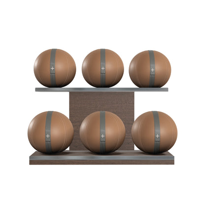 Six brown leather medicine balls with grey accent leather, arranged on two shelves made of natural walnut wood. PENT. MOXA Set Ultimate - Set of 6 Medicine Balls on Horizontal Wooden Stand