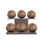 Six brown leather medicine balls with grey accent leather, arranged on two shelves made of natural walnut wood. PENT. MOXA Set Ultimate - Set of 6 Medicine Balls on Horizontal Wooden Stand