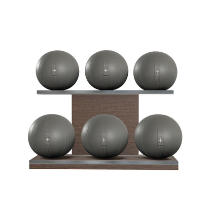 Six grey leather medicine balls with grey accent leather, arranged on two shelves made of natural walnut wood. PENT. MOXA Set Ultimate - Set of 6 Medicine Balls on Horizontal Wooden Stand