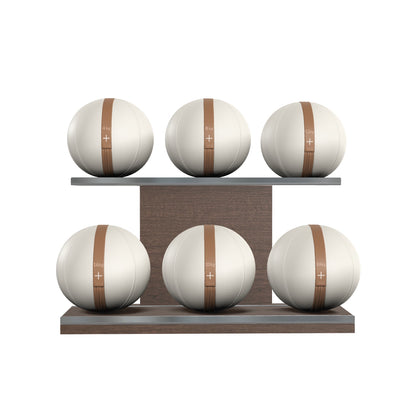 Six white leather medicine balls with brown accent leather, arranged on two shelves made of natural walnut wood. PENT. MOXA Set Ultimate - Set of 6 Medicine Balls on Horizontal Wooden Stand