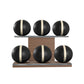 Six black leather medicine balls with beige accent leather, arranged on two shelves made of natural walnut wood. PENT. MOXA Set Ultimate - Set of 6 Medicine Balls on Horizontal Wooden Stand