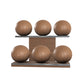 Six brown leather medicine balls with brown accent leather, arranged on two shelves made of natural walnut wood. PENT. MOXA Set Ultimate - Set of 6 Medicine Balls on Horizontal Wooden Stand