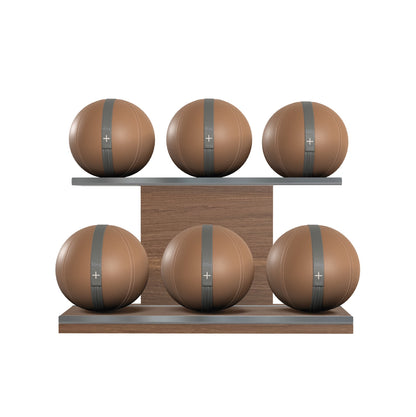 Six brown leather medicine balls with grey accent leather, arranged on two shelves made of natural walnut wood. PENT. MOXA Set Ultimate - Set of 6 Medicine Balls on Horizontal Wooden Stand