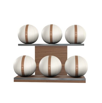 Six white leather medicine balls with brown accent leather, arranged on two shelves made of natural walnut wood. PENT. MOXA Set Ultimate - Set of 6 Medicine Balls on Horizontal Wooden Stand