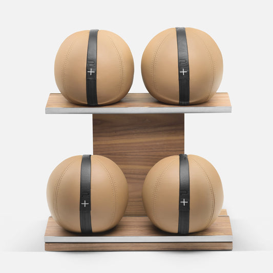 PENT MOXA weighted gym balls on a horizontal stand by Cycling Bears, customisable in different weights.