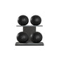 Four black leather medicine balls with black accent leather, arranged on two shelves made of black ash wood. PENT. MOXA Power - Set of 4 Medicine Balls on Horizontal Wooden Stand