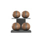 Four brown leather medicine balls with grey accent leather, arranged on two shelves made of black ash wood. PENT. MOXA Power - Set of 4 Medicine Balls on Horizontal Wooden Stand