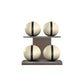 Four beige leather medicine balls with black accent leather, arranged on two shelves made of natural walnut wood. PENT. MOXA Power - Set of 4 Medicine Balls on Horizontal Wooden Stand