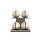 Four beige leather medicine balls with grey accent leather, arranged on two shelves made of natural walnut wood. PENT. MOXA Power - Set of 4 Medicine Balls on Horizontal Wooden Stand