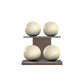 Four beige leather medicine balls with white accent leather, arranged on two shelves made of natural walnut wood. PENT. MOXA Power - Set of 4 Medicine Balls on Horizontal Wooden Stand