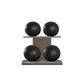 Four black leather medicine balls with black accent leather, arranged on two shelves made of natural wood. PENT. MOXA Power - Set of 4 Medicine Balls on Horizontal Wooden Stand