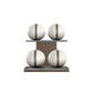 Four white leather medicine balls with grey accent leather, arranged on two shelves made of natural walnut wood. PENT. MOXA Power - Set of 4 Medicine Balls on Horizontal Wooden Stand