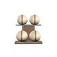Four beige leather medicine balls with brown accent leather, arranged on two shelves made of natural walnut wood. PENT. MOXA Power - Set of 4 Medicine Balls on Horizontal Wooden Stand
