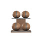 Four brown leather medicine balls with grey accent leather, arranged on two shelves made of natural walnut wood. PENT. MOXA Power - Set of 4 Medicine Balls on Horizontal Wooden Stand