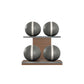 Four grey leather medicine balls with white accent leather, arranged on two shelves made of natural walnut wood. PENT. MOXA Power - Set of 4 Medicine Balls on Horizontal Wooden Stand