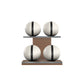 Four white leather medicine balls with black accent leather, arranged on two shelves made of natural walnut wood. PENT. MOXA Power - Set of 4 Medicine Balls on Horizontal Wooden Stand