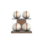 Four white leather medicine balls with brown accent leather, arranged on two shelves made of natural walnut wood. PENT. MOXA Power - Set of 4 Medicine Balls on Horizontal Wooden Stand