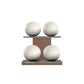 Four white base leather medicine balls with white accent leather, arranged on two shelves made of natural walnut wood. PENT. MOXA Power - Set of 4 Medicine Balls on Horizontal Wooden Stand