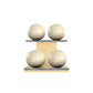 Four beige leather medicine balls with beige accent leather, arranged on two shelves made of natural ash wood. PENT. MOXA Power - Set of 4 Medicine Balls on Horizontal Wooden Stand