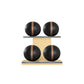 Four black leather medicine balls with brown accent leather, arranged on two shelves made of natural ash wood. PENT. MOXA Power - Set of 4 Medicine Balls on Horizontal Wooden Stand