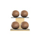 Four brown leather medicine balls with brown accent leather, arranged on two shelves made of natural ash wood. PENT. MOXA Power - Set of 4 Medicine Balls on Horizontal Wooden Stand