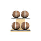 Four brown leather medicine balls with white accent leather, arranged on two shelves made of natural ash wood. PENT. MOXA Power - Set of 4 Medicine Balls on Horizontal Wooden Stand