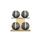 Four grey leather medicine balls with beige accent leather, arranged on two shelves made of natural ash wood. PENT. MOXA Power - Set of 4 Medicine Balls on Horizontal Wooden Stand