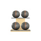 Four grey leather medicine balls with brown accent leather, arranged on two shelves made of natural ash wood. PENT. MOXA Power - Set of 4 Medicine Balls on Horizontal Wooden Stand