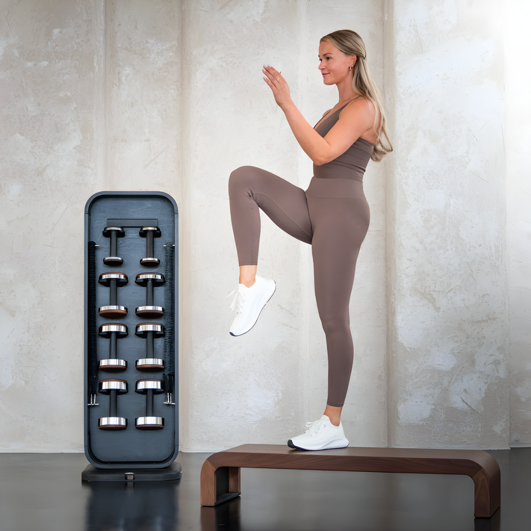 User performing a step workout on the NOHRD StepTower, demonstrating fluid motion and ergonomic stance.