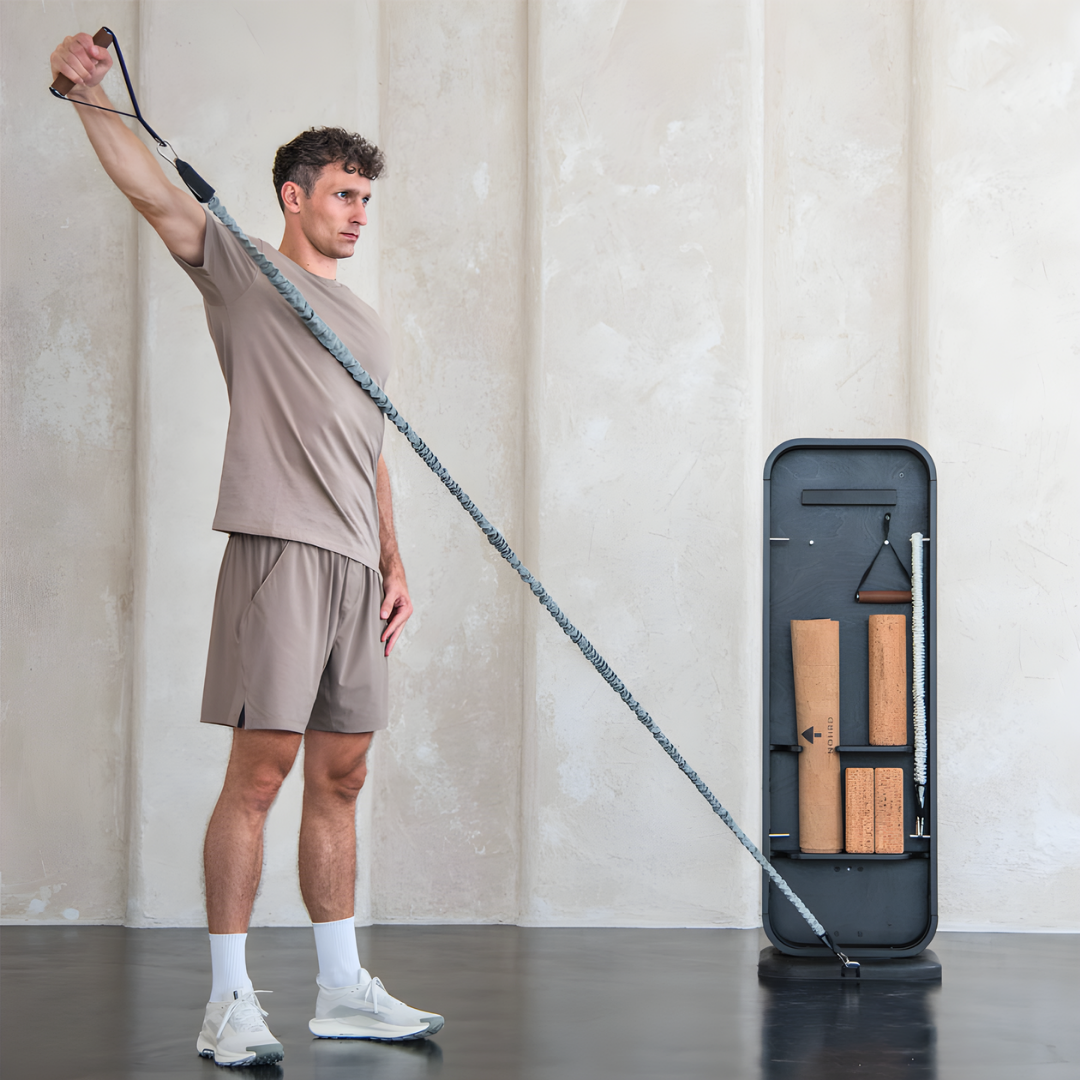Person using the NOHRD StepTower for a full-body workout in a modern home gym.