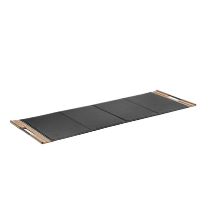Luxurious fitness equipment, premium exercise mat handcrafted with natural wood and genuine Italian leather, in default black color. PENT. MATA