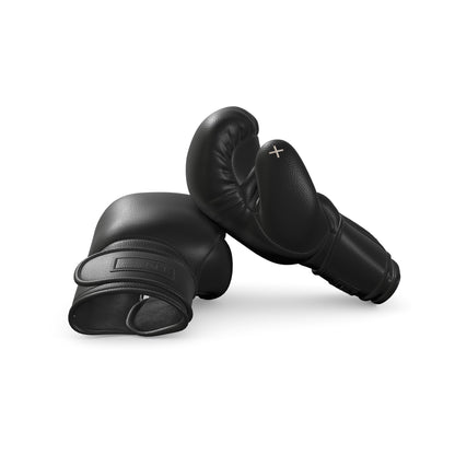 Luxury fitness equipment, handmade boxing gloves with premium Italian leather, both base & accent leather in black color. PENT. RAXA - Luxury Boxing Gloves