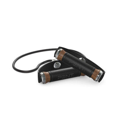 Luxury gym equipment, handcrafted resistance band with natural walnut wood and premium black leather. PENT. RESA - Luxury Fitness Resistance Band