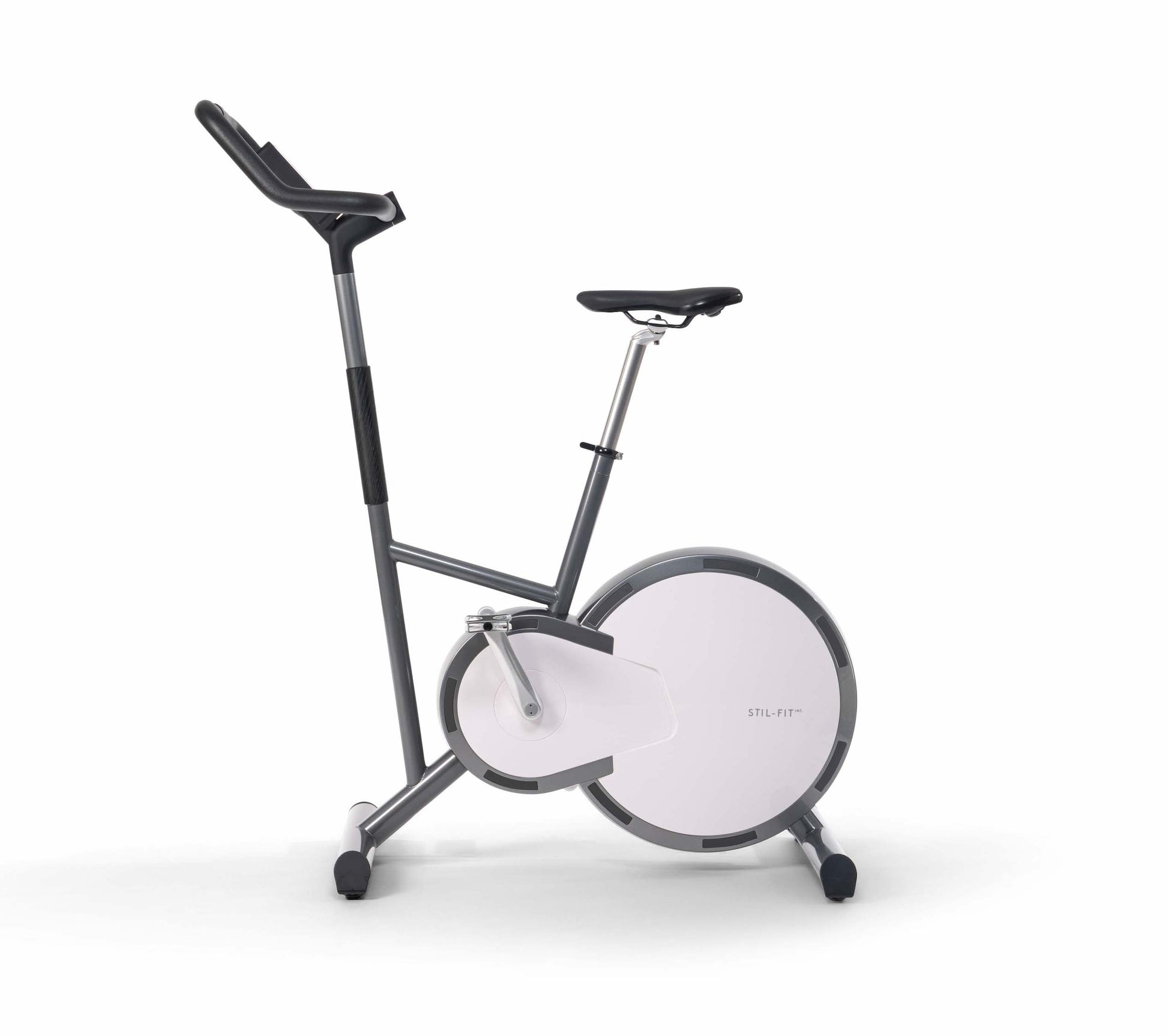 A stylish modern exercise bike with a sleek design, black wood panel, featuring three adjustable grip positions and a multifunctional console. Stil-Fit Ergometer Pure - Stationary Bike