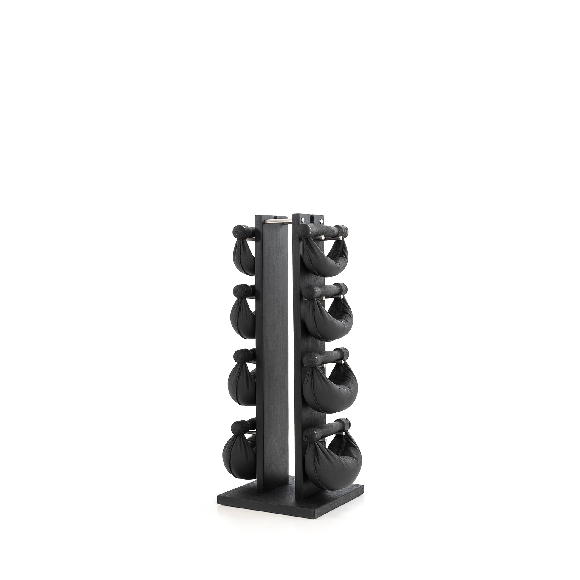 Sideview of six black leather swingbell are neatly arranged on a black wooden rack, highlighting craftsmanship and simplicity in design. NOHRD Swing Tower - Leather Dumbbell Set