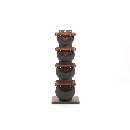 Six black leather swingbell are neatly arranged on a natural walnut wooden rack, highlighting craftsmanship and simplicity in design. NOHRD Swing Tower - Leather Dumbbell Set
