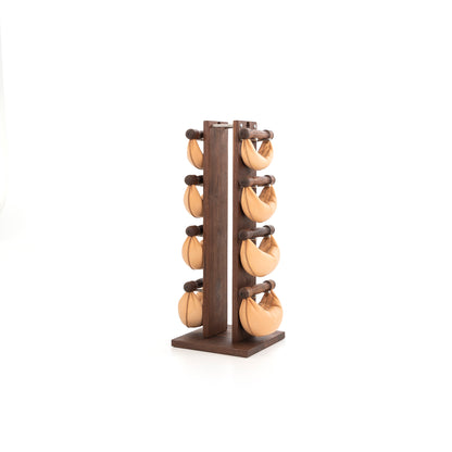 Sideview of six natural leather wooden swingbell are neatly arranged on a natural walnut wooden rack, highlighting craftsmanship and simplicity in design. NOHRD Swing Tower - Leather Dumbbell Set