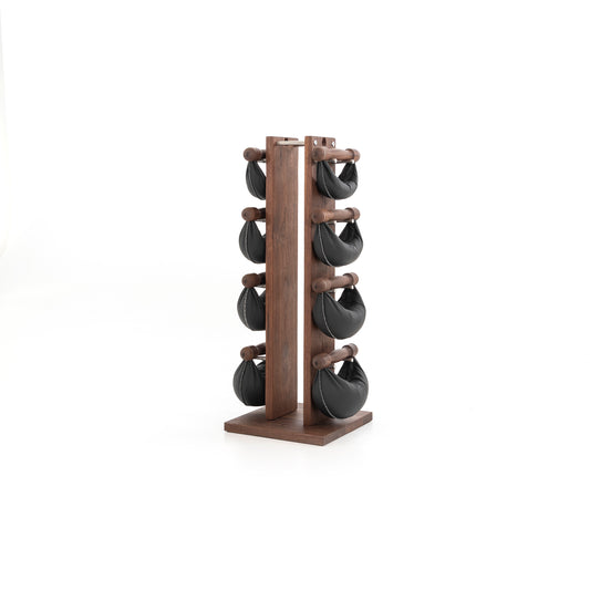 Sideview of six swingbell with black leather are neatly arranged on walnut wooden rack, highlighting craftsmanship and simplicity in design. NOHRD Swing Tower - Leather Dumbbell Set