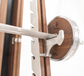 Close up view of a luxurious squat rack made with natural wood and stainless steel, perfect for a large range of activities. NOHRD Squat Rack