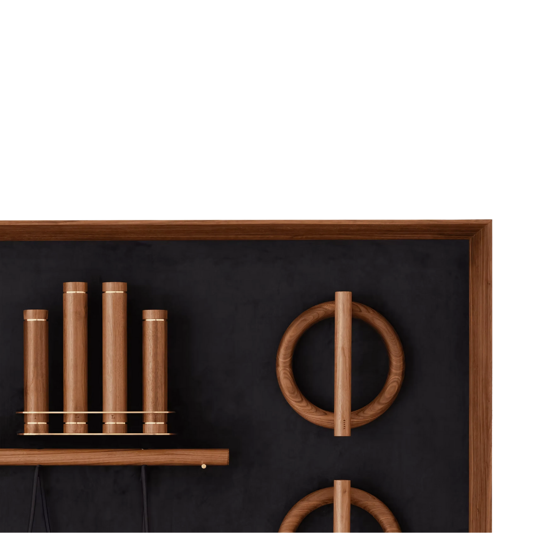 Push-up bars with cork handles arranged on minimalist wooden wall rack.