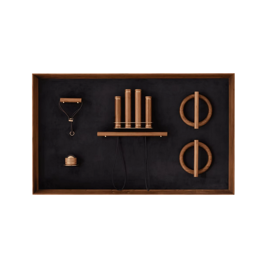 Kenko Wall Set “L” – sculptural wall-mounted fitness set in walnut with brass accents.