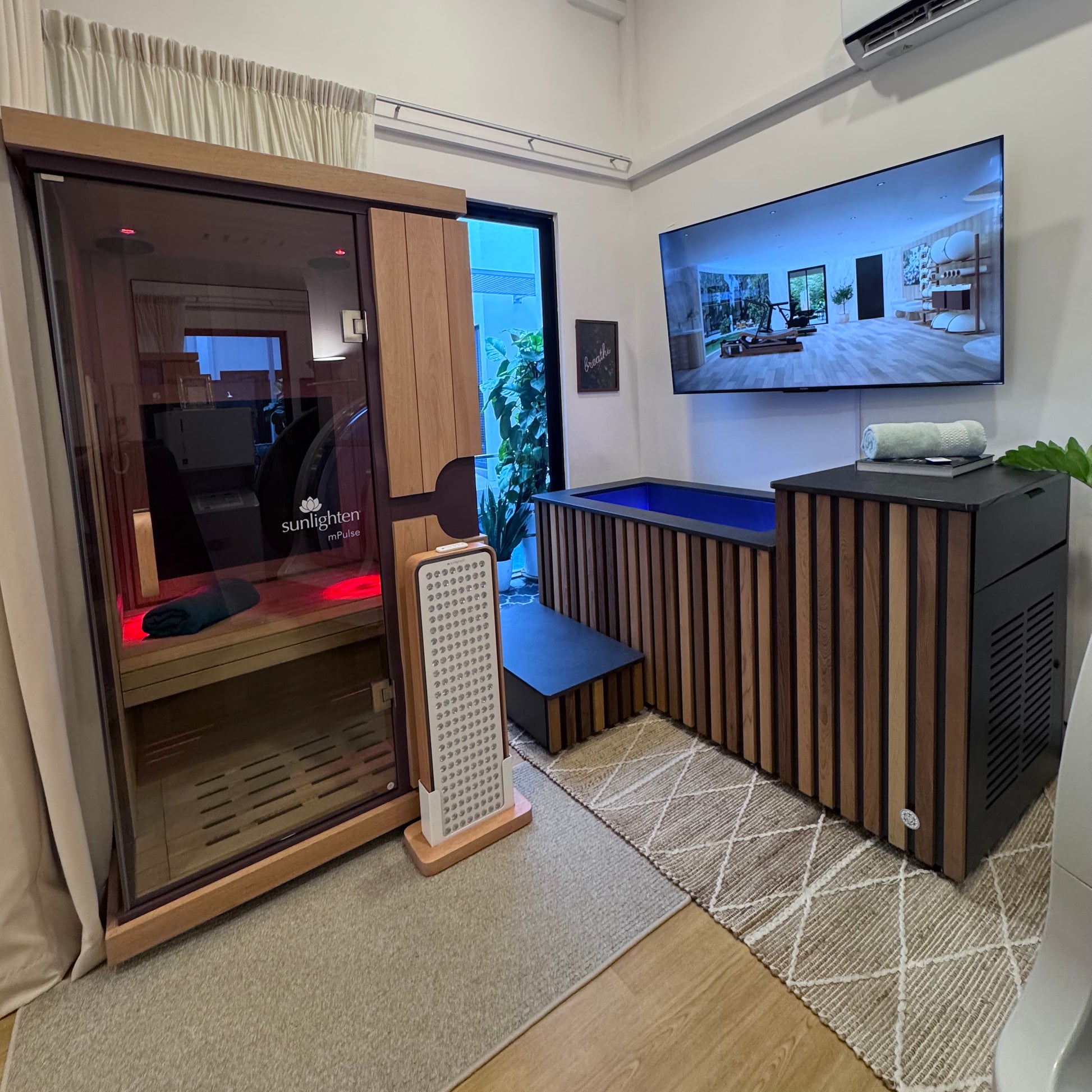 Premium contrast therapy zone with full-spectrum infrared sauna and British-crafted ice bath.