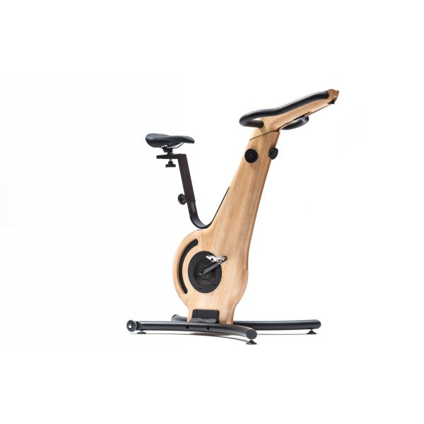 A modern exercise bike with a ash wooden frame and minimalist design, featuring an adjustable seat and streamlined structure. NOHRD Bike V2