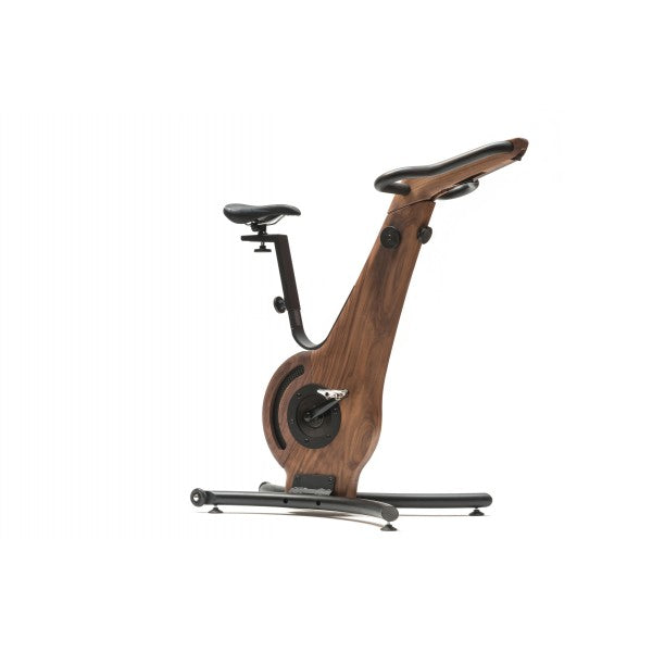 A modern exercise bike with a walnut wooden frame and minimalist design, featuring an adjustable seat and streamlined structure. NOHRD Bike V2