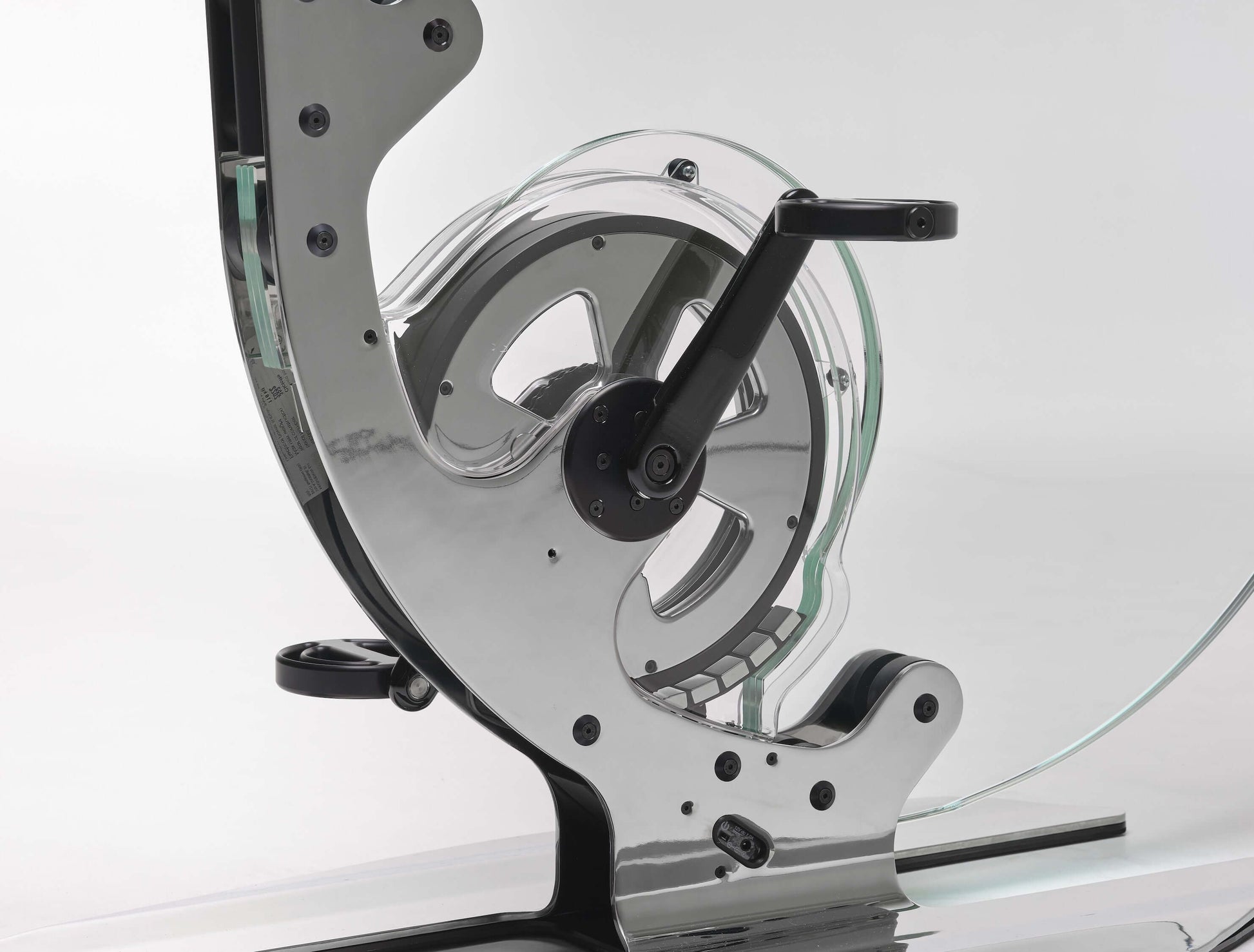 Extremely close up view of a luxurious gym equipment, Italian design exercise bike made of crystal glass. Ciclotte Teckell - Glass Exercise Bike
