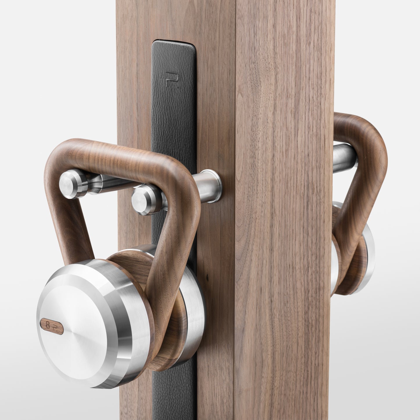 Close up view of the Luxury fitness equipment, 4 luxury kettlebells on vertical wooden stand, handcrafted with stainless steel, premium Italian leather and natural wood. PENT. LOVA Set