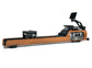 A luxury fitness equipment, walnut wooden water rowing machine for full-body workout with the soothing sounds of water. Stil-Fit Flow One - Rowing Machine with water resistance