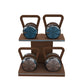 Luxury fitness equipment, 4 luxury kettlebells on horizontal wooden stand, handcrafted with stainless steel, premium Italian leather and natural wood. Custom variation 15. PENT. LOVA Set - Kettlebells on a Horizontal Stand